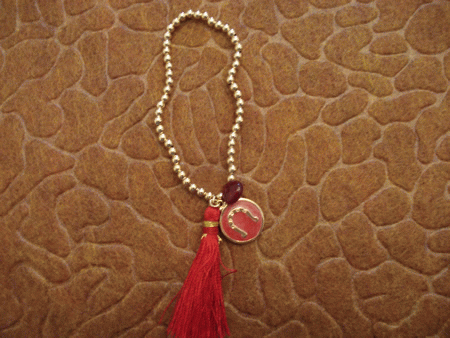 Model # 6401 3 mm Gold Filled with Ruby Drop, Enamel Horseshoe Charm and Red Silk Tassel