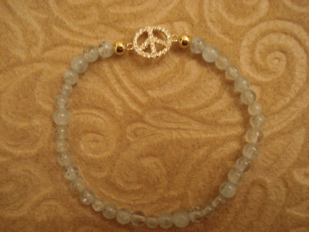 Model # 7204 4 mm Aquamarine Stone with Gold Plated Cubic Zirconia Peace Sign