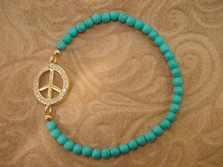Model # 8504 4 mm Turquoise with Gold Cubic Zirconia Peace Sign
