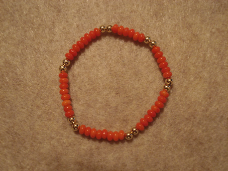 Model # 8605 4 mm Semiprecious Orange Coral beads with "2 and 2" 4 mm Gold Filled Beads 